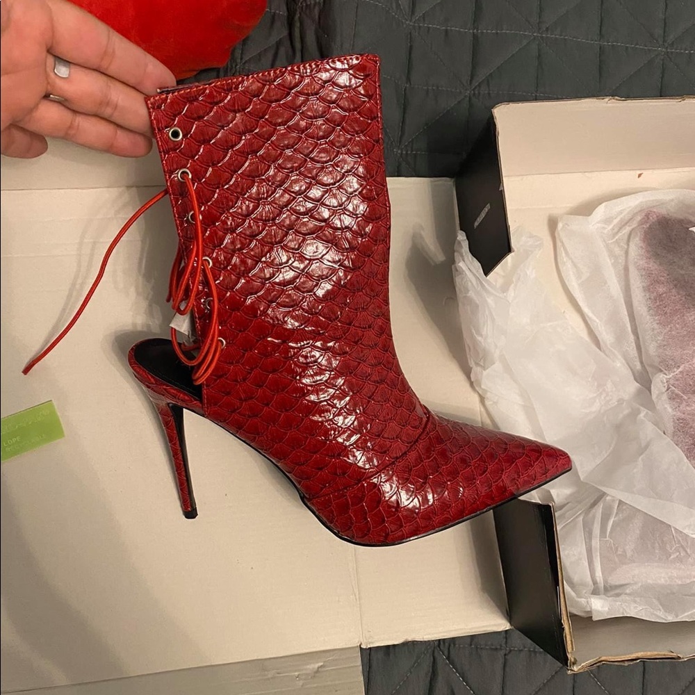 Red snake skin stilettos